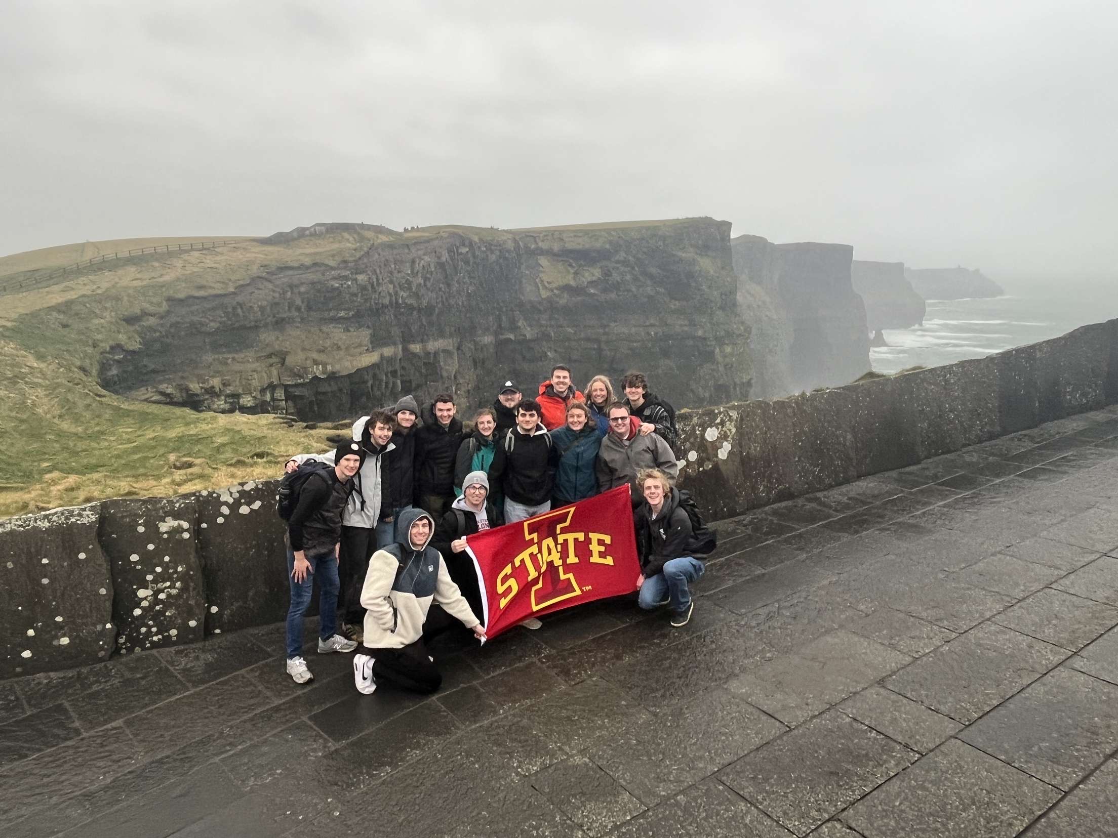 Students pose for a picture at the Cliffs of Moher in Ireland.