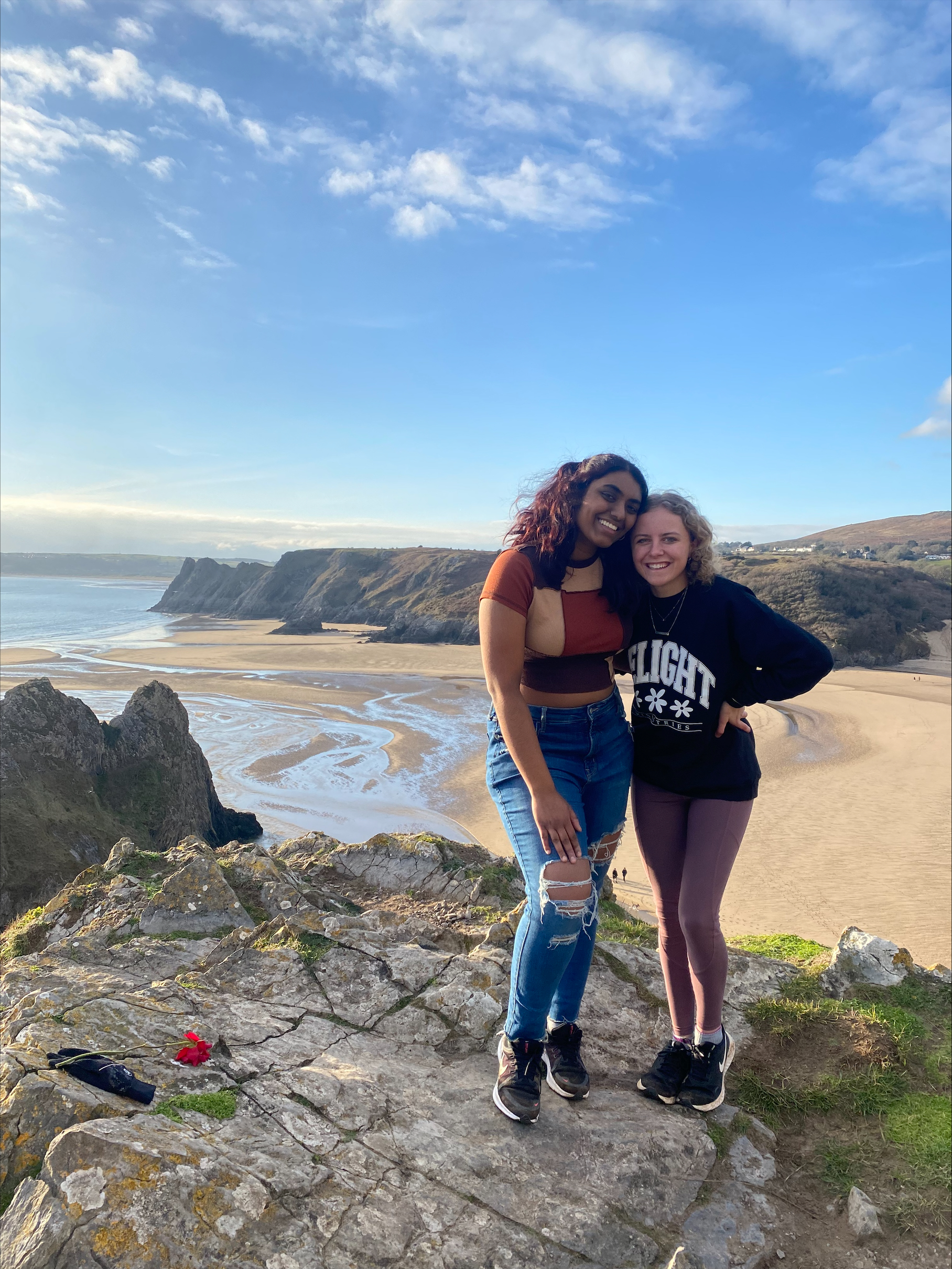 Two students enjoy the Welsh coast.