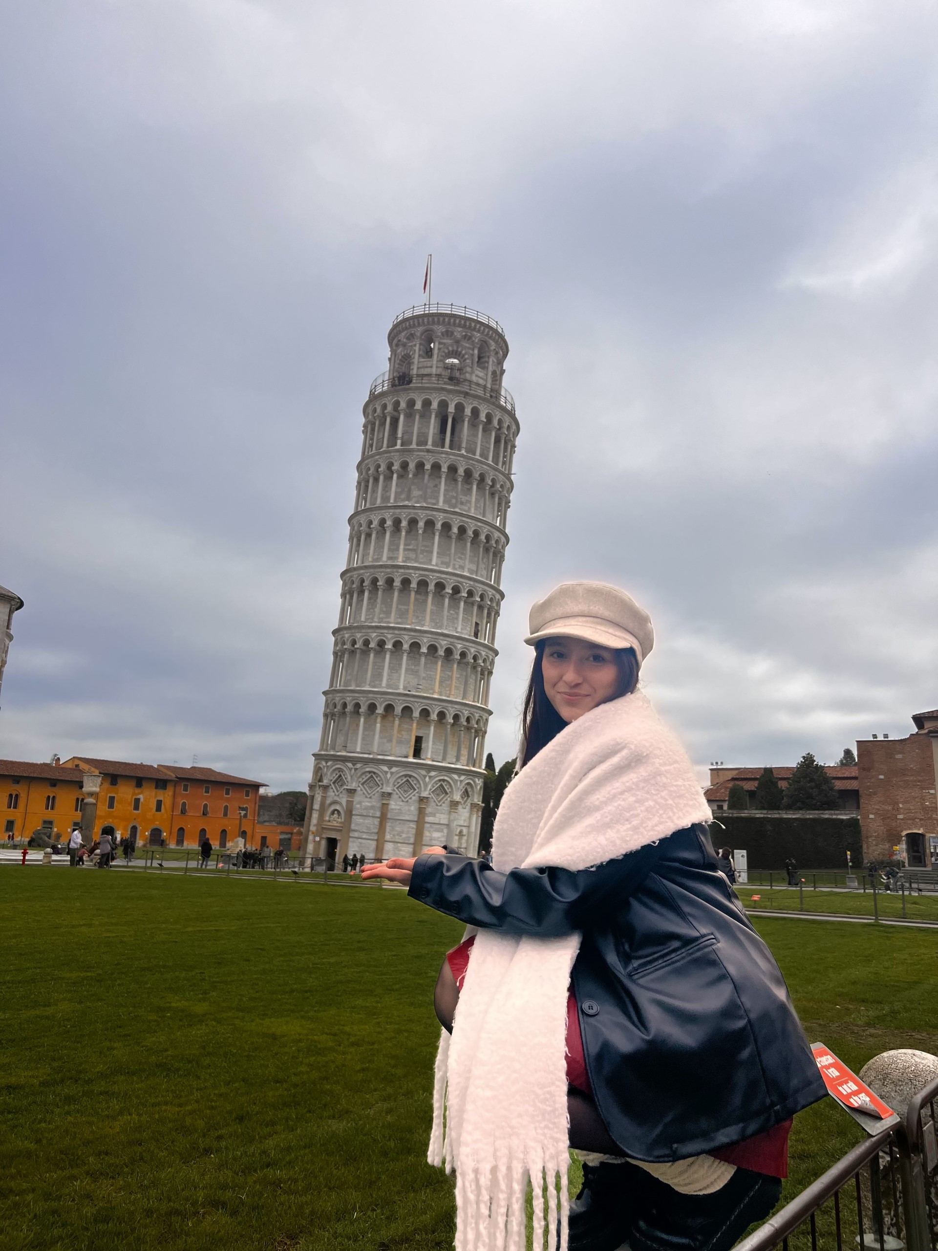 A student poses with the Leaning Tower of Pisa.