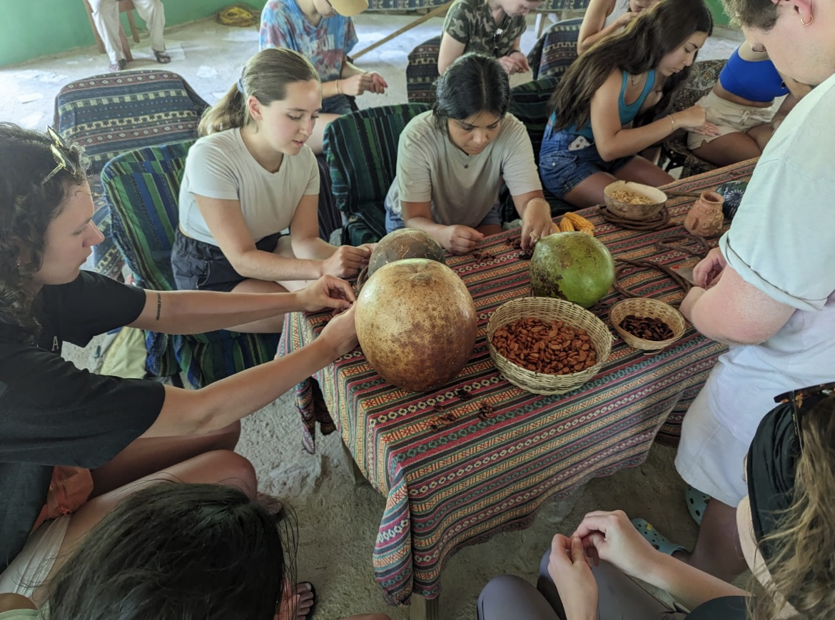 Group sitting around a table with food